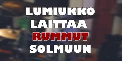 Lumiukko laittaa rummut solmuun